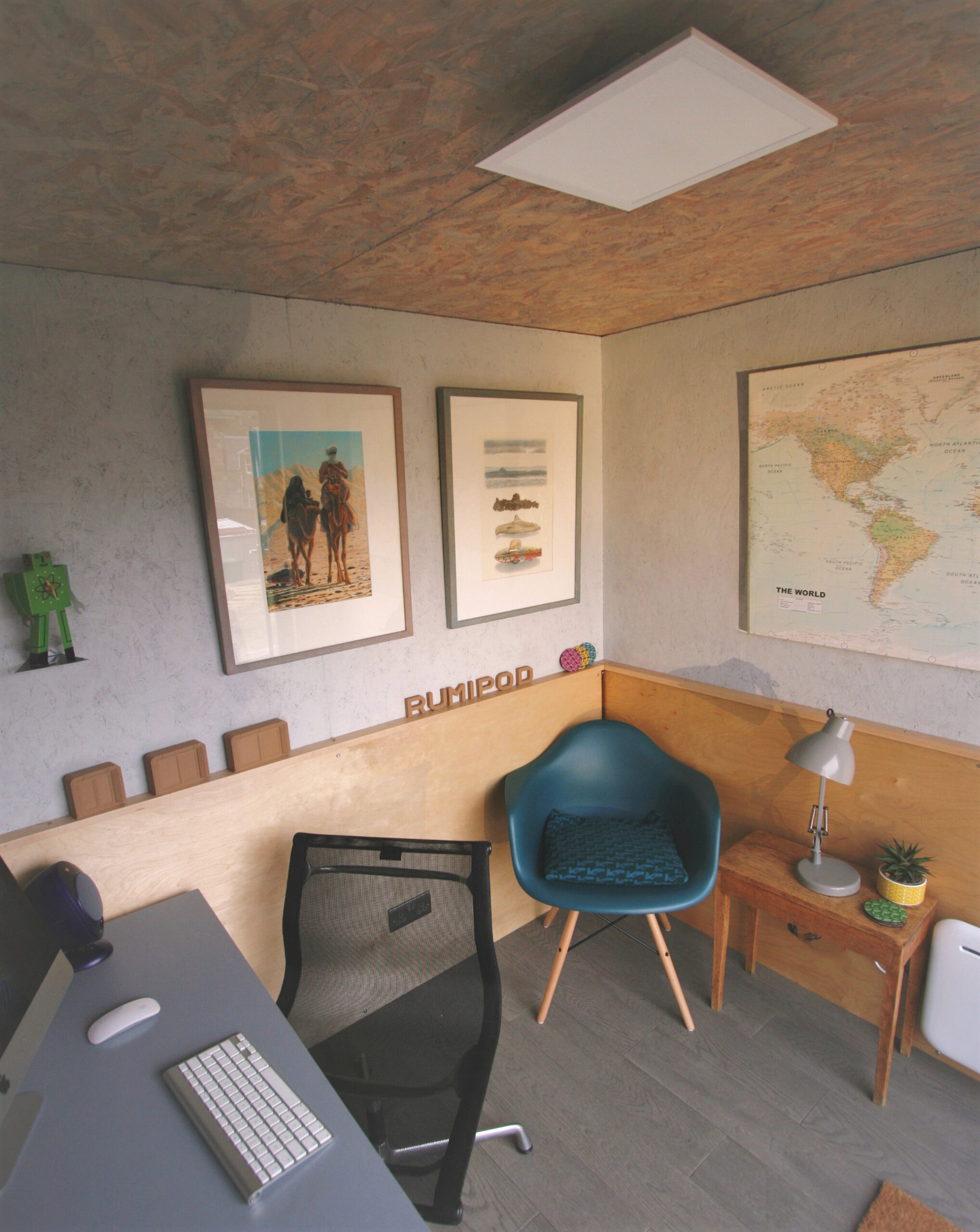 inside of garden room, shown as a home office, angled view to chair in corner